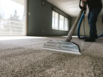 Extraction wand cleaning a carpet